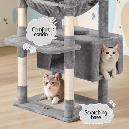Cat tree with two cats on a wooden floor